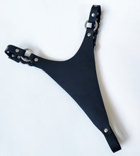 Load image into Gallery viewer, Adjustable high cut thong in 2mm thick matte black leather and nickel hardware. Handmade in New Zealand by Gemma Proebst.

