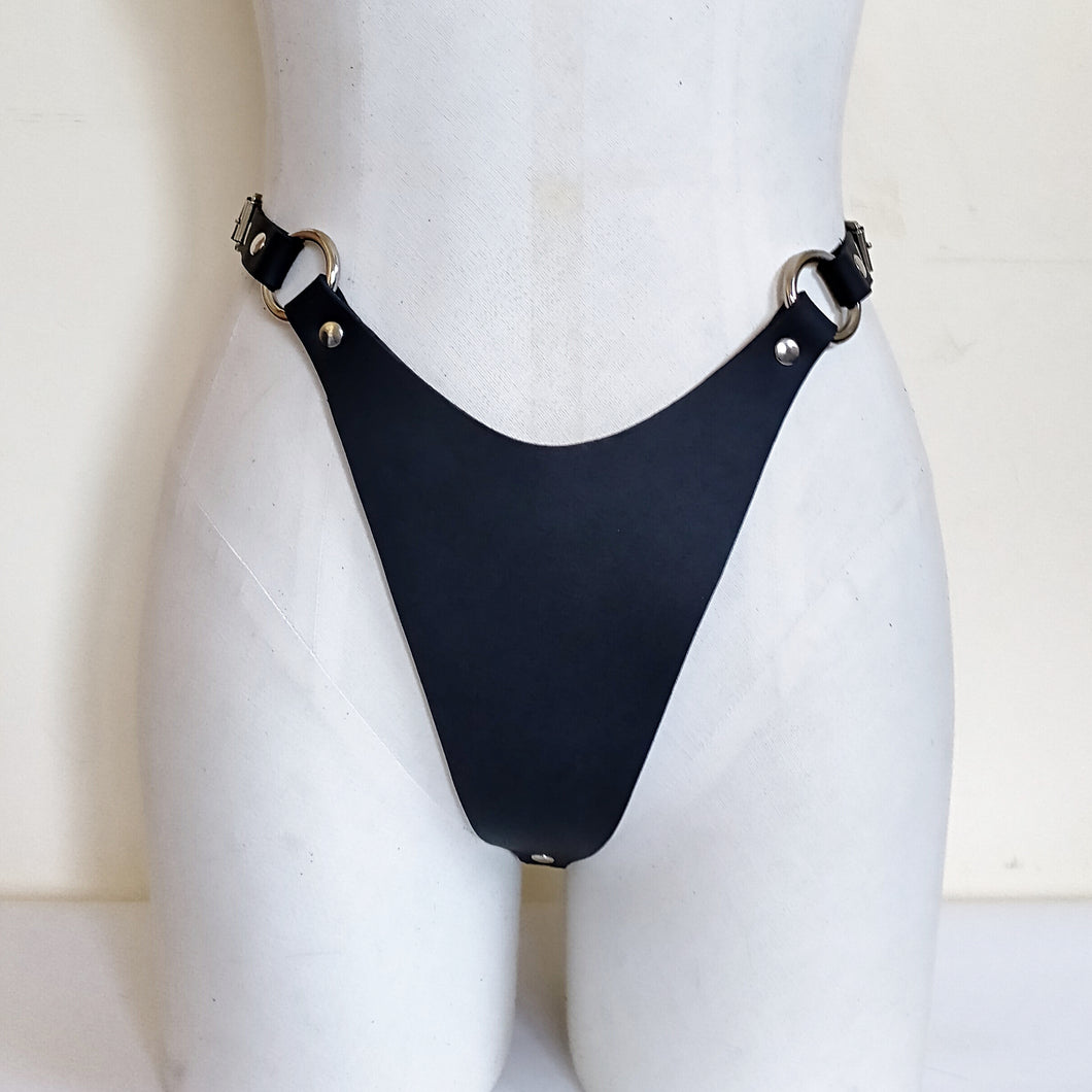 Adjustable high cut thong in 2mm thick matte black leather and nickel hardware. Handmade in New Zealand by Gemma Proebst.