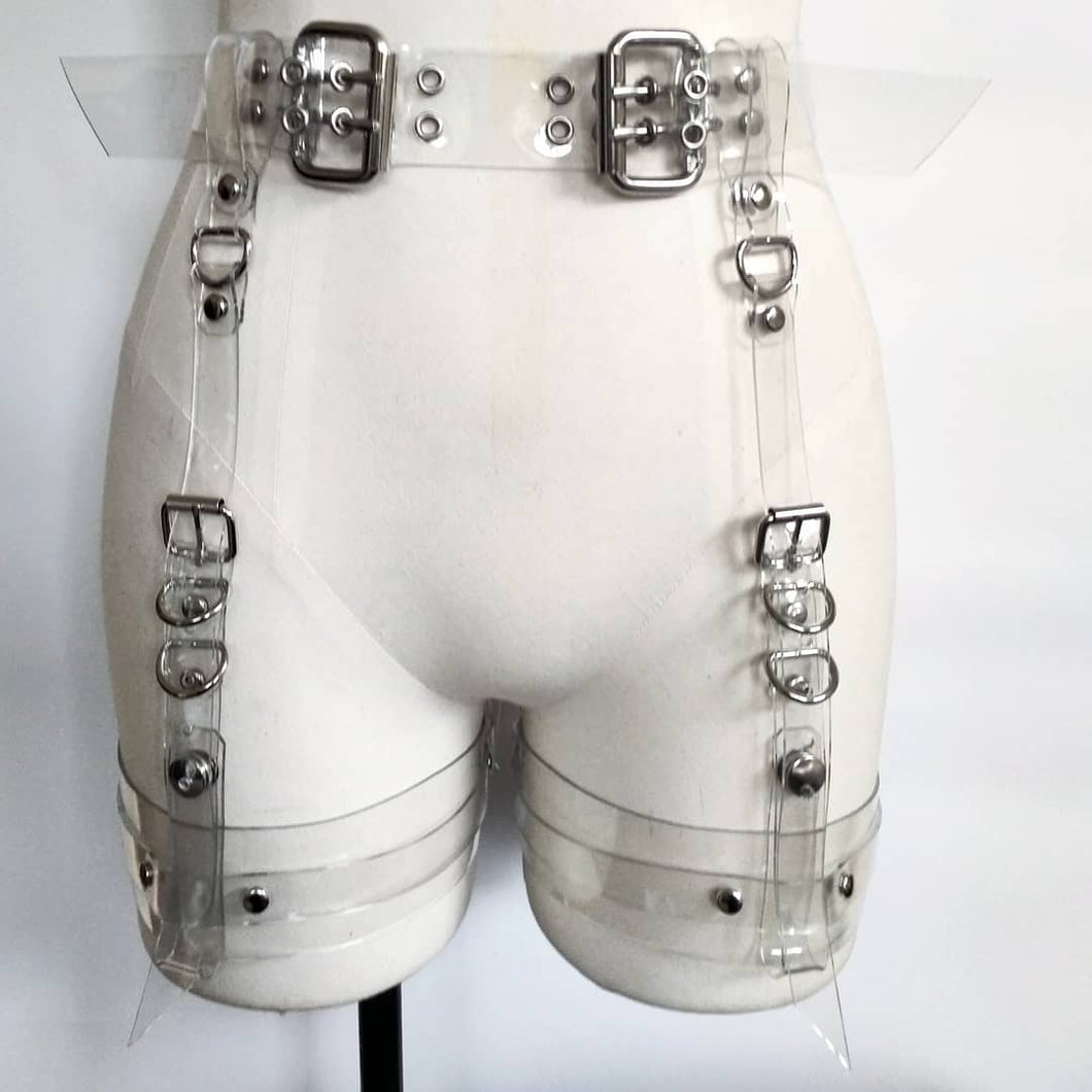 Gemma Proebst Adjustable garter harness in 2mm PVC with nickel hardware. The thigh straps can be removed to be used as separate restraints or accessories.