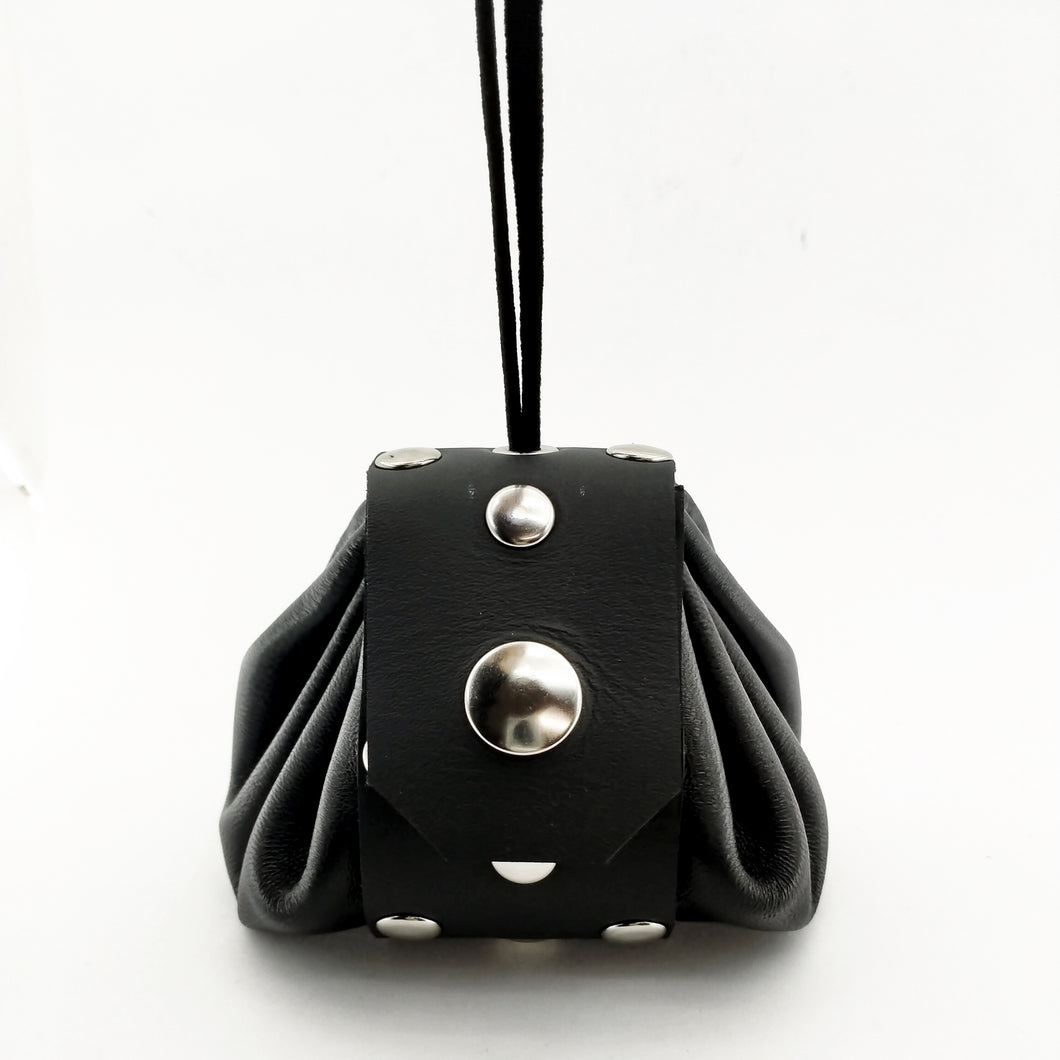 Leather pouch with elastic draw string. The lid is secured with a heavy snap. Handmade in New Zealand by Gemma Proebst.